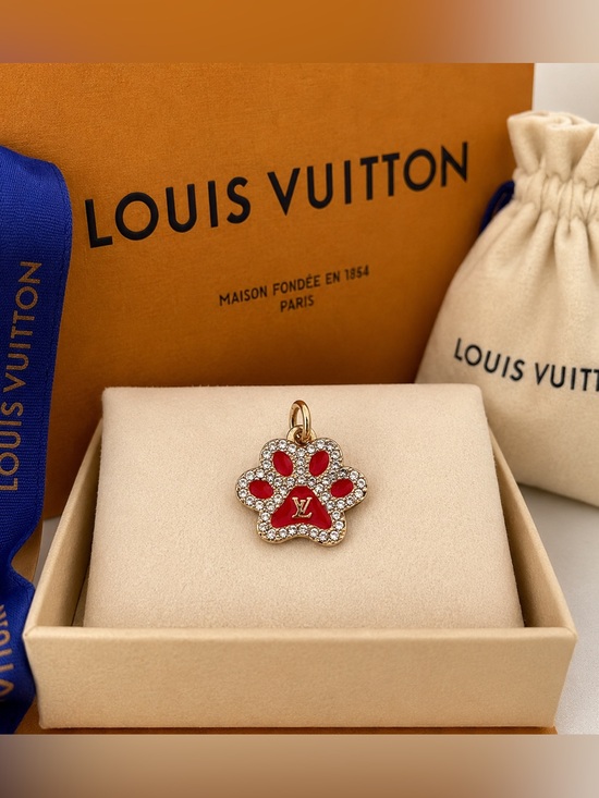 . Jewelry - Louis Vuitton stamped Red and Gold toned Paw Charm with Crystals